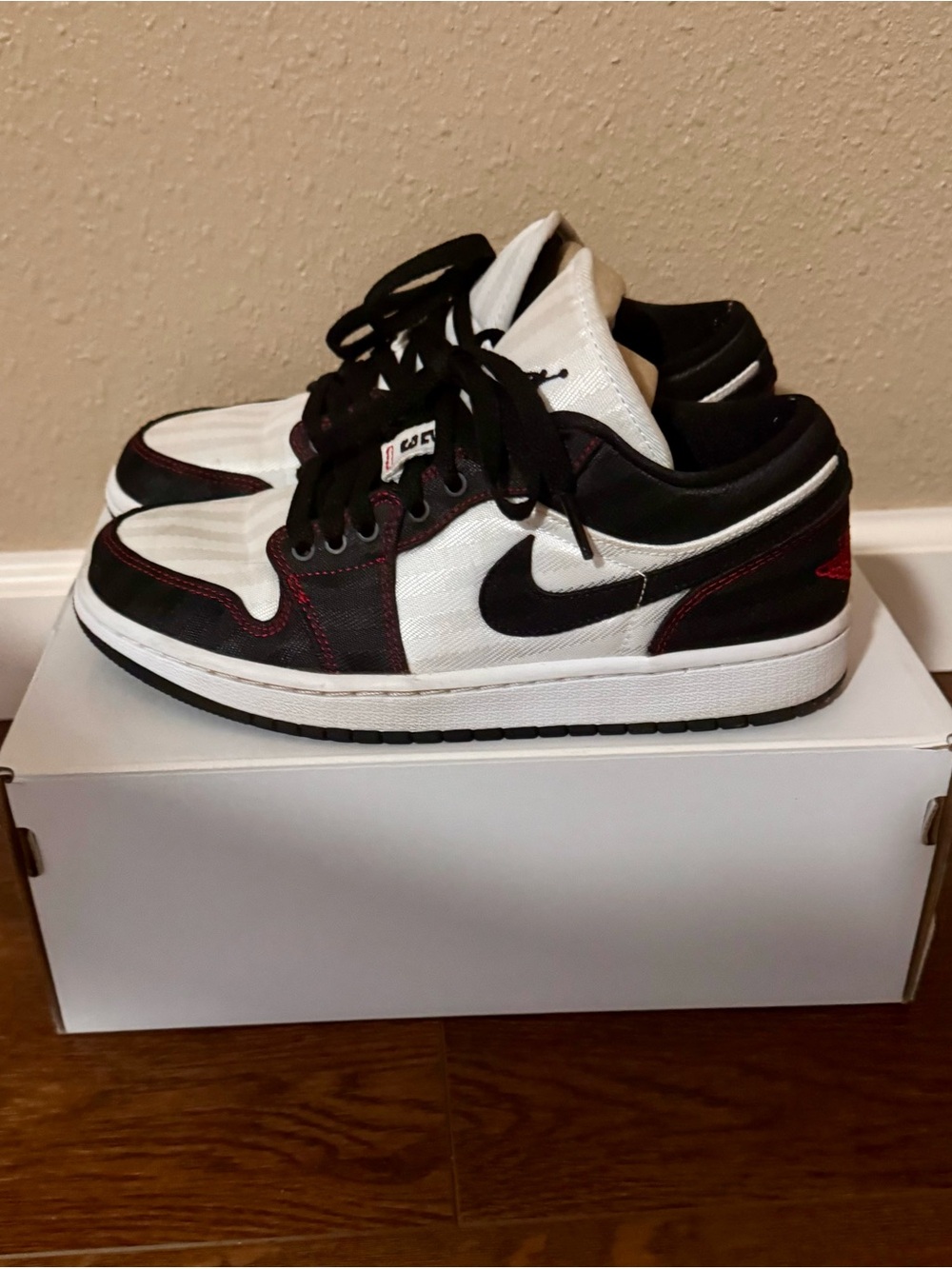 Nike Jordan Low-Top Sneakers in White, Black with Red Stitching